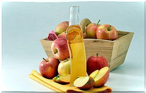 apples and bottle of apple cider vinegar