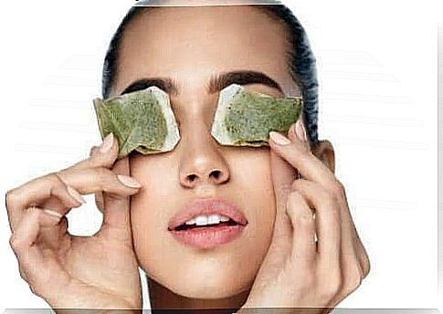 Woman with tea bags on the eyes to reduce sore eyes