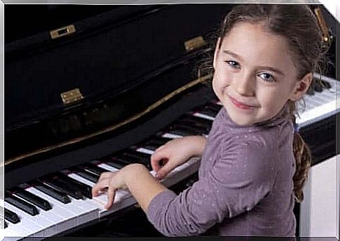 Young girl playing piano