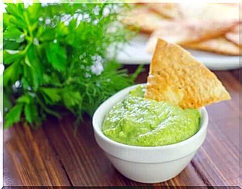 Bowl of dipping sauce with a chip