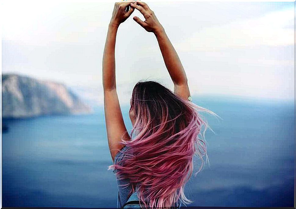 Girl looking out over the sea from a height