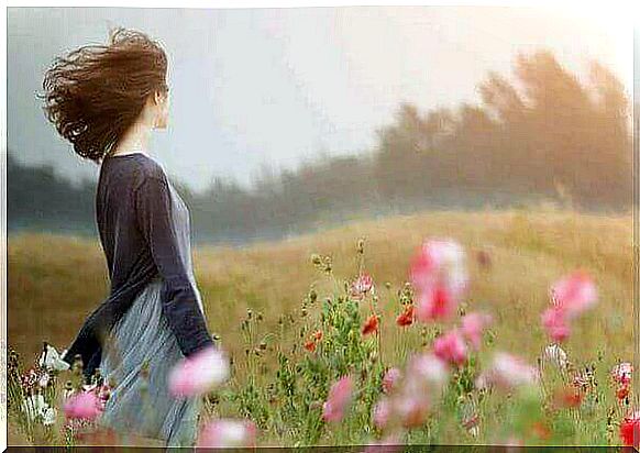 Woman in a windy field