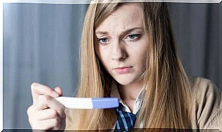 Woman looking at pregnancy test